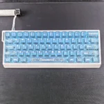 Adorable Cinnamoroll translucent PC keycaps set arranged playfully, highlighting their dreamy blue mist glow and transparent design, perfect for captivating setup.