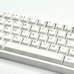 A vibrant colorful PBT keycaps set, dynamically angled to reveal its playful spectrum of hues, perfect for personalizing custom keyboards with modern design.