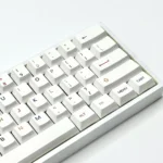 Vibrant, colorful PBT keycaps set for custom keyboards, shown from a playful angle. Features a dynamic spectrum of colors for personalized, modern setup.