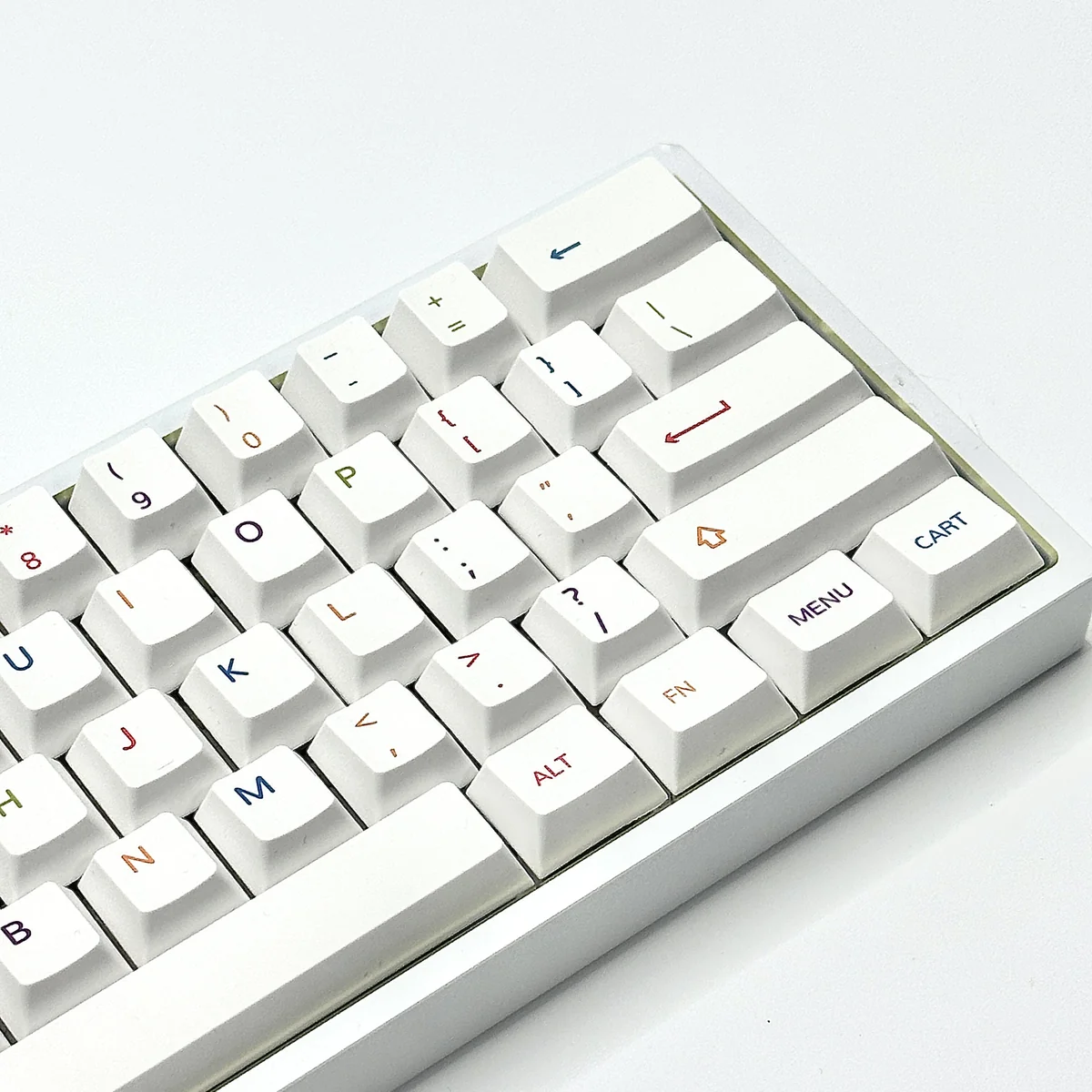 Vibrant, colorful PBT keycaps set for custom keyboards, shown from a playful angle. Features a dynamic spectrum of colors for personalized, modern setup.