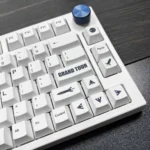 Monochromatic Cosmic PBT Keycaps Set in a gallery, revealing their durable PBT material and artistic monochromatic cosmic designs with celestial bodies.
