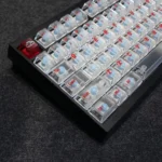 Playful Crayon Shin-chan mist translucent PC keycaps set for custom keyboards. Anime designs glow vibrantly with RGB, shown from many angles.