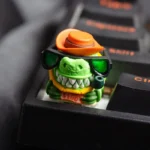 Artisan handcrafted crocodile resin keycap, an intricate ESC masterpiece. Showcases a powerful, dark, textured motif and unique desktop presence.