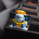 Close-up of a handcrafted dark resin crocodile keycap, intricately sculpted with powerful scales, forming a unique artisan ESC key desktop statement.