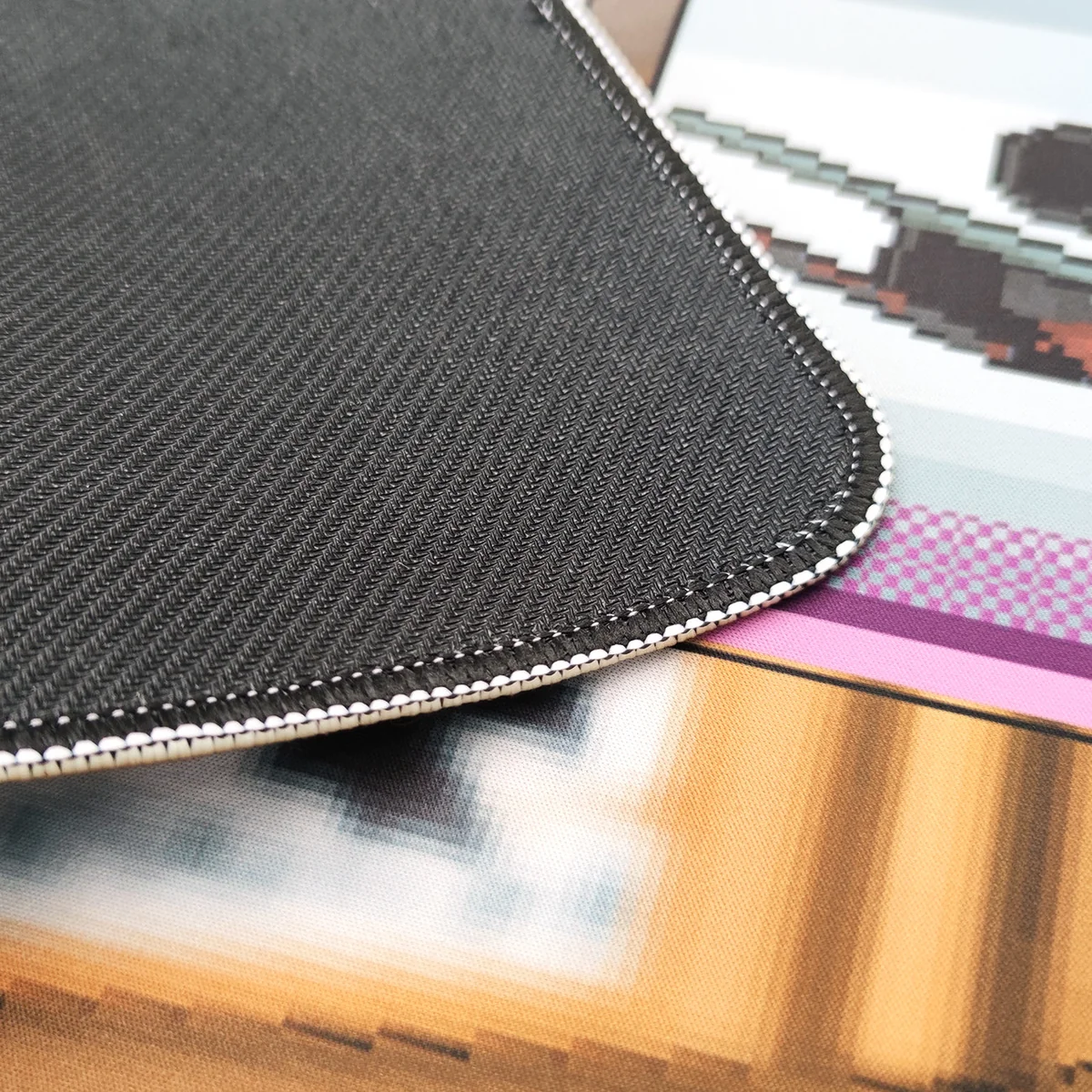 Experience the golden drop unboxing thrill with this vibrant pixel art CSGO mousepad, vividly displayed from a captivating side angle, showcasing its gaming design.