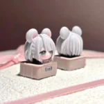 Close-up view of the handcrafted Delta Force Hackclaw artisan keycap, revealing its vibrant, stylized mouse character art from multiple expressive angles.