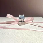 Angled close-up of the Handcrafted Delta Force Luna Artisan Keycap, highlighting its intricate sculpted details and premium dark cat motifs.