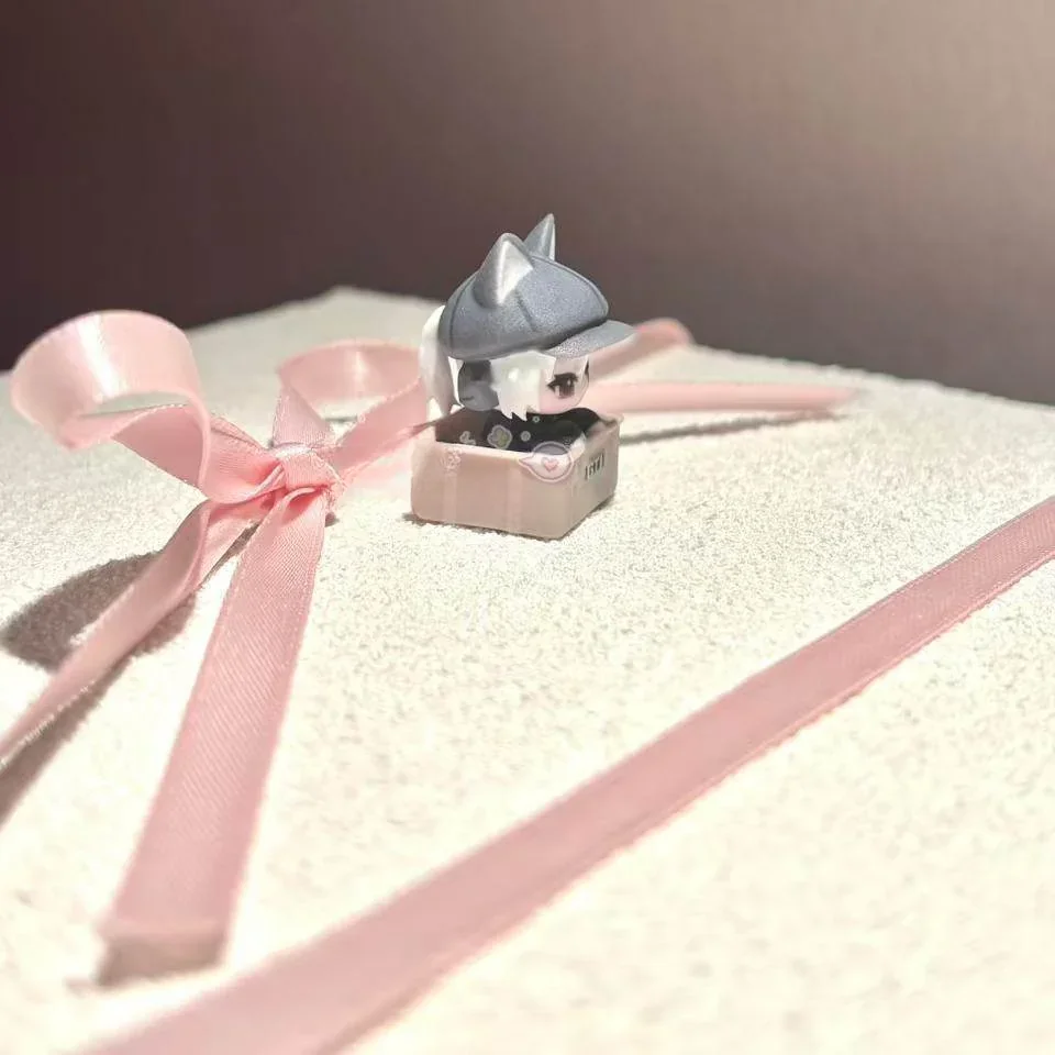 Handcrafted Delta Force Luna artisan keycap, showcasing its intricate sculpted details and dark, playful cat motif from a unique angle.