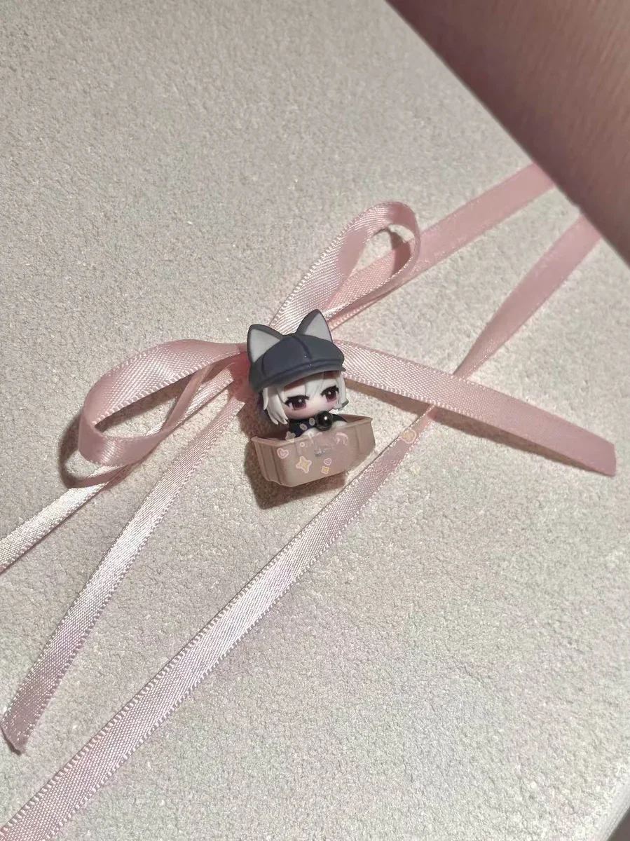 Close-up of the handcrafted Delta Force Luna artisan keycap, revealing its intricate sculpting and dark, playful cat motif from a distinctive design.