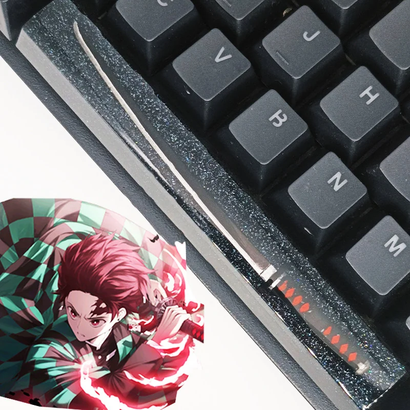 Detailed gallery of the artisan Demon Slayer RGB spacebar keycap, revealing anime characters in luminous resin with a starry translucent finish.
