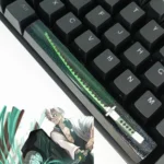 Artisan Demon Slayer RGB spacebar keycap in vibrant fluorescent green resin, highlighting a luminous starry anime design.