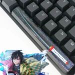 Artisan Demon Slayer RGB spacebar keycap featuring a luminous blue water pillar design, showcasing intricate anime resin craftsmanship with a translucent design.