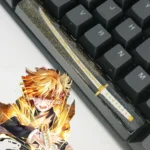 Artisan Demon Slayer RGB spacebar keycap: a yellow-themed anime character in a sleeping pose, crafted from luminous, starry resin.