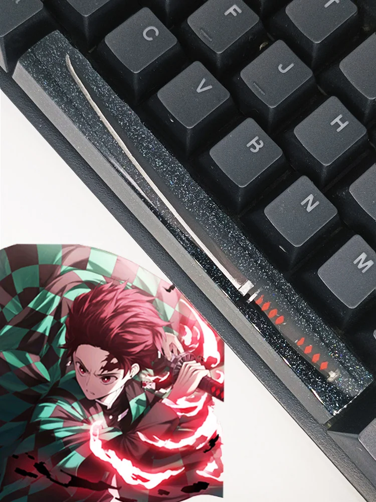Artisan Demon Slayer RGB spacebar keycap featuring in striking black and red resin with a luminous, starry finish.