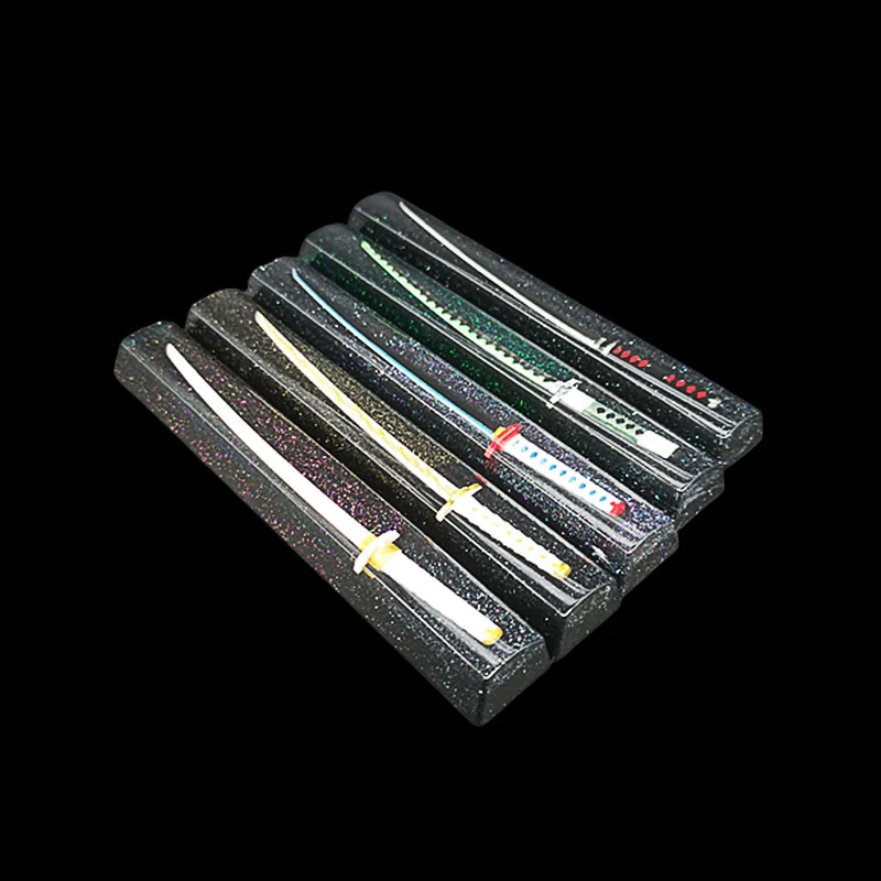 Close-up of an exquisite Artisan Demon Slayer RGB Spacebar Keycap, featuring anime art embedded in luminous, starry resin.