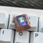 A premium Nezuko Kamado Demon Slayer titanium artisan keycap, meticulously crafted and anodized, shown from various angles highlighting its vibrant design.