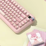 Premium PBT MDA Dessert Rabbit keycaps set from a playful angle, showcasing adorable dessert illustrations in a pastel pink and yellow gradient.