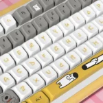 Whimsical dog PBT MDA keycaps set, various angles showcasing adorable dog illustrations, paw prints, and a warm palette, highlighting durable design.