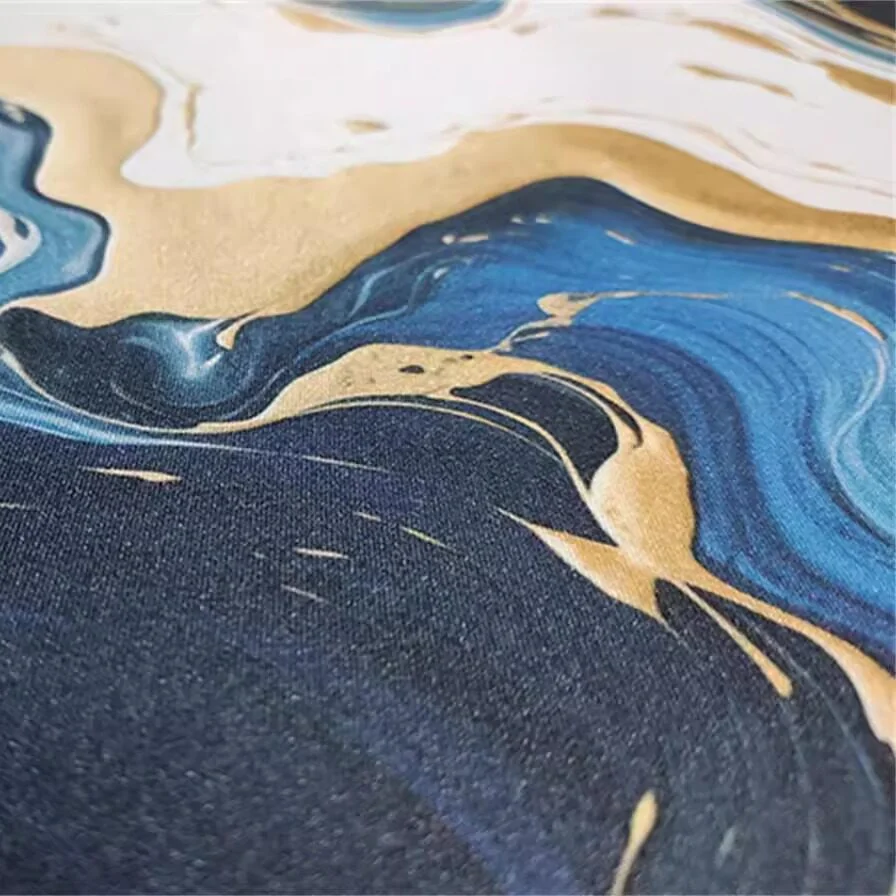 Dynamic Blue White Gold Mouse Pad showcasing its waterproof surface and non-slip backing from a unique angle, perfect for creative workspaces.