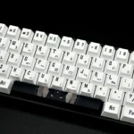 A close-up view of durable PBT Egypt keycaps set showcasing intricate hieroglyphs and pharaoh designs, highlighting their unique ancient artistry.