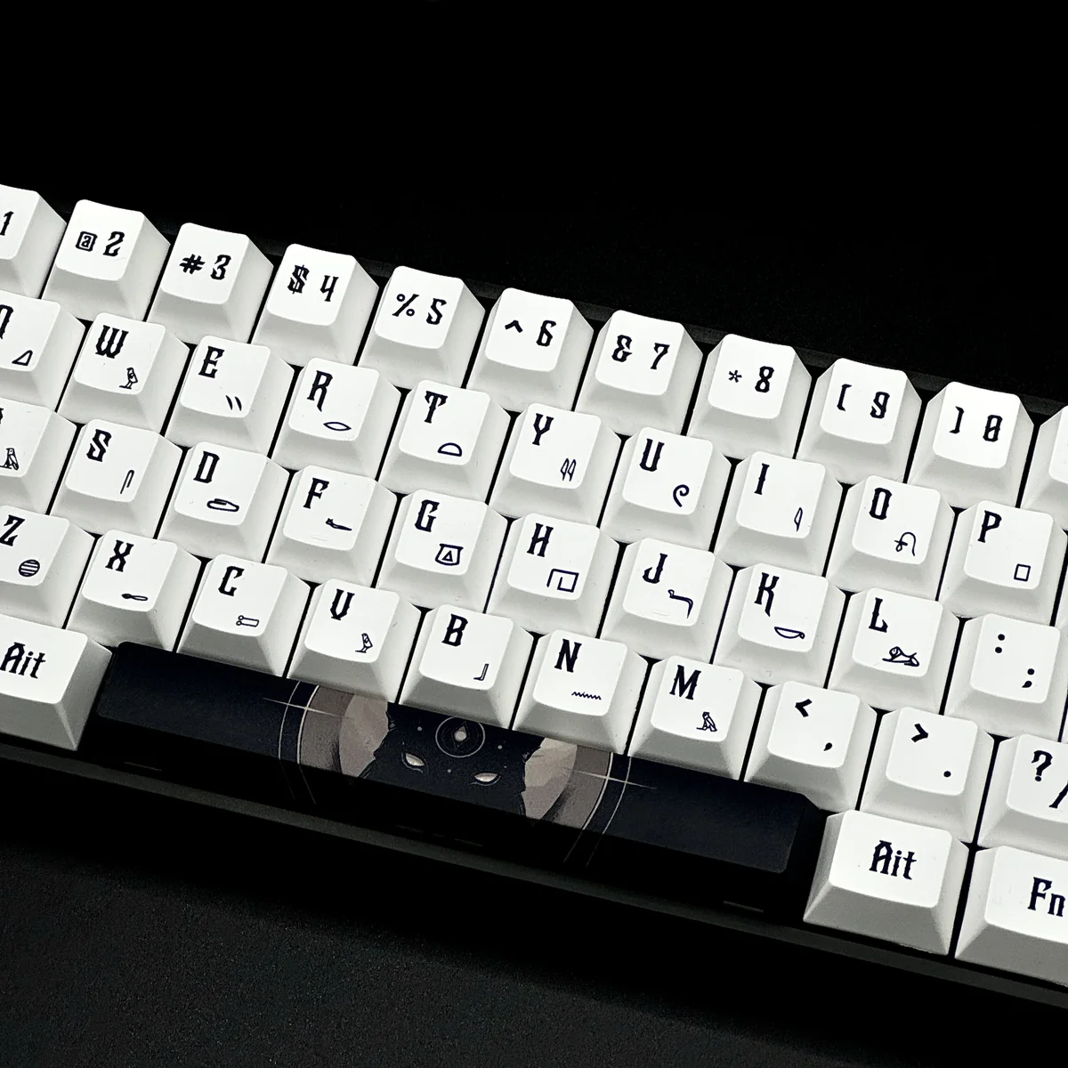 A close-up view of durable PBT Egypt keycaps set showcasing intricate hieroglyphs and pharaoh designs, highlighting their unique ancient artistry.