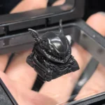 Close-up of a meticulously handcrafted Elden Ring Malenia sculpted resin art keycap in elegant black, showcasing intricate fantasy detail for gaming fans.