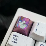 Elysia Titanium ESC Keycap (Honkai Impact 3rd), displaying ethereal art on polished titanium from various angles, a premium blend of elegance and gaming fans.