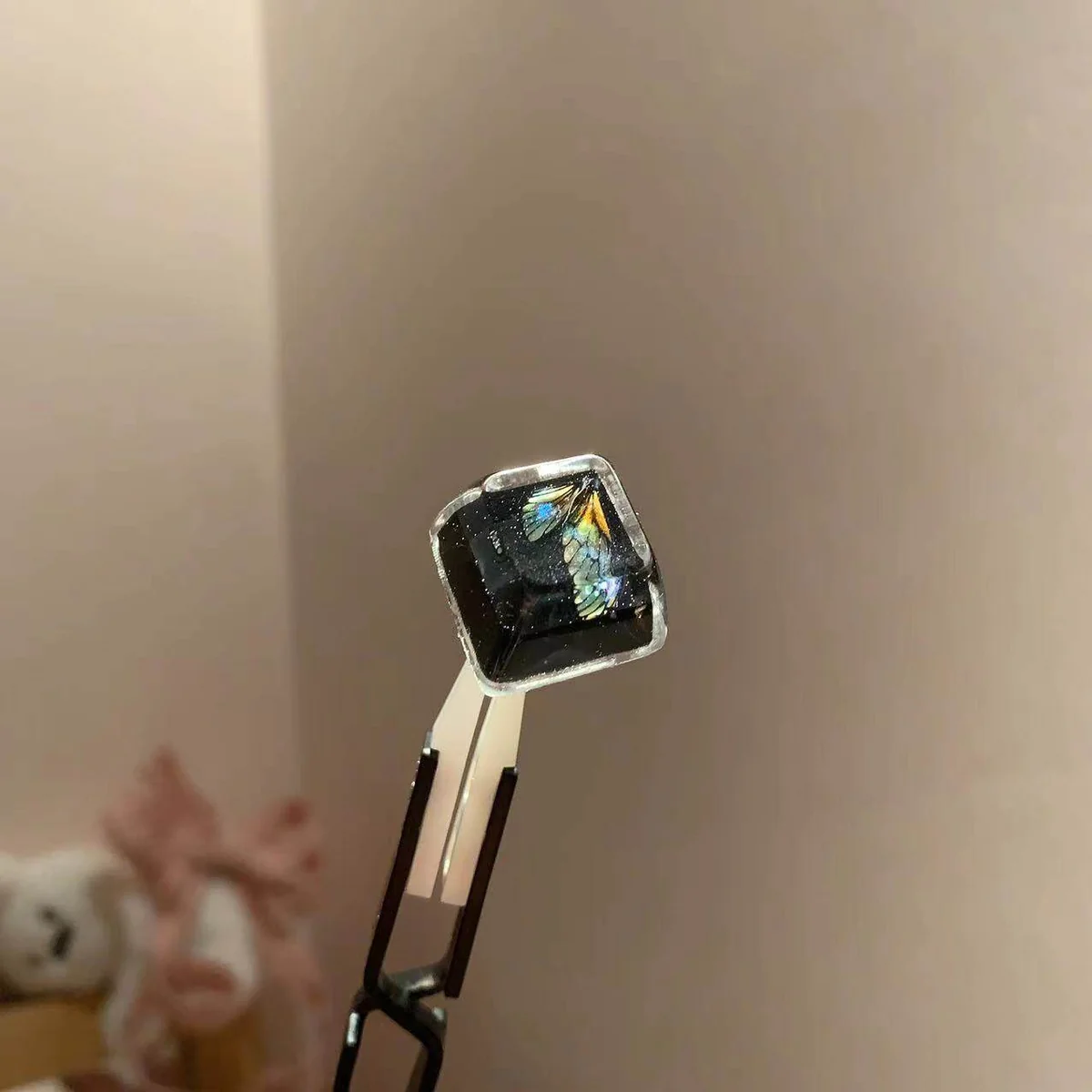 Close-up of an exquisite handcrafted Wind translucent artisan keycap, revealing its ethereal Wind play and delicate, nature-inspired abstract design.