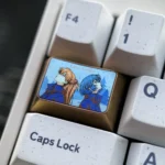 Premium titanium Evangelion keycap featuring intricate Asuka and Rei art, shown from multiple angles to highlight its durable, high-tech design.