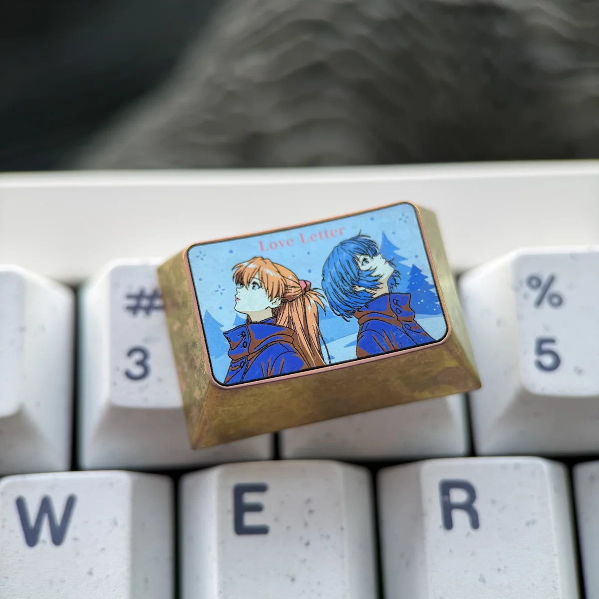 A gallery of Evangelion Keycaps, meticulously crafted from premium titanium, showcasing Asuka and Rei's intricate art from multiple angles for mechanical keyboard.