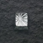 Explosion Silver keycap, a premium sculpted zinc alloy art piece with a dynamic electroplated iridescent sheen.