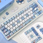 Detailed shot of the unique Fallen Alice in Wonderland dark fantasy keycaps set, revealing intricate, melancholic designs and whimsical characters.