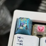 Exclusive Hatsune Miku Titanium Artisan ESC Keycap from multiple angles, showcasing its festive art and polished craftsmanship, a premium collectible design.