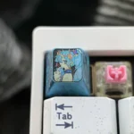 Exclusive Hatsune Miku Titanium Artisan ESC Keycap. Polished titanium, iconic Miku art, and festive motifs from various artistic angles.
