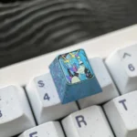 Detailed view of the premium Hatsune Miku Titanium Artisan ESC Keycap, highlighting its iconic festive design and exquisite titanium finish.
