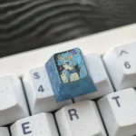 Exclusive Hatsune Miku Titanium Artisan ESC Keycap, shown from a captivating angle, highlighting its vibrant festive art and polished titanium craftsmanship.