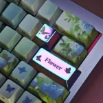 An exquisite artisan Flower butterfly keycap featuring vibrant metallic wings and delicate floral designs, capturing nature's elegant beauty.