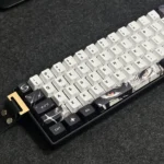 Flowing Shadow Cherry Keycap Set, multi-angle. Features subtle side legends and luminous, dynamic light interplay for an artistic desk design.