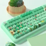 Close-up of the Whimsical Forest Party PBT Keycaps Set, showcasing the vibrant green forest theme with detailed whimsical creatures and botanic design.
