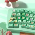 Vibrant Forest Party Keycaps Set PBT, shown from multiple angles. Highlights lush green scenery, whimsical creatures, and botanical designs. Refreshing aesthetics.