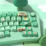 This vibrant PBT Forest Party Keycaps Set captures a whimsical forest celebration with lush green botanical elements and charming creatures.