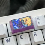 Multiple views highlight the Frieren & Fern titanium artisan keycap's elegant anime etching on sleek, durable titanium. A premium Frieren keycap.