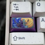 A stunning Frieren keycap featuring Frieren & Fern, meticulously crafted from sleek titanium. This premium artisan keycap showcases elegant anime art.