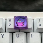 Close-up of a premium Gengar titanium low-profile keycap, showcasing its mischievous artistry and intricate sculpting from an angled perspective.