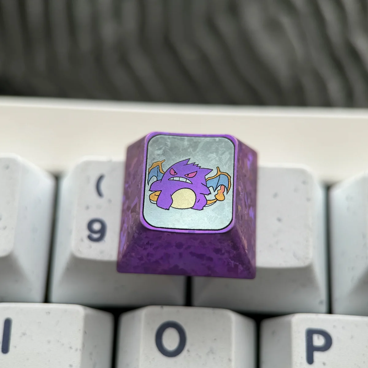 Premium Gengar Titanium Artisan ESC Keycap from various angles, highlighting its iconic design and durable titanium craftsmanship for keyboard art.