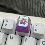 Premium Gengar Titanium Artisan ESC Keycap, an iconic keyboard art piece. Detailed views highlight its durable titanium craftsmanship and dark whimsy design.