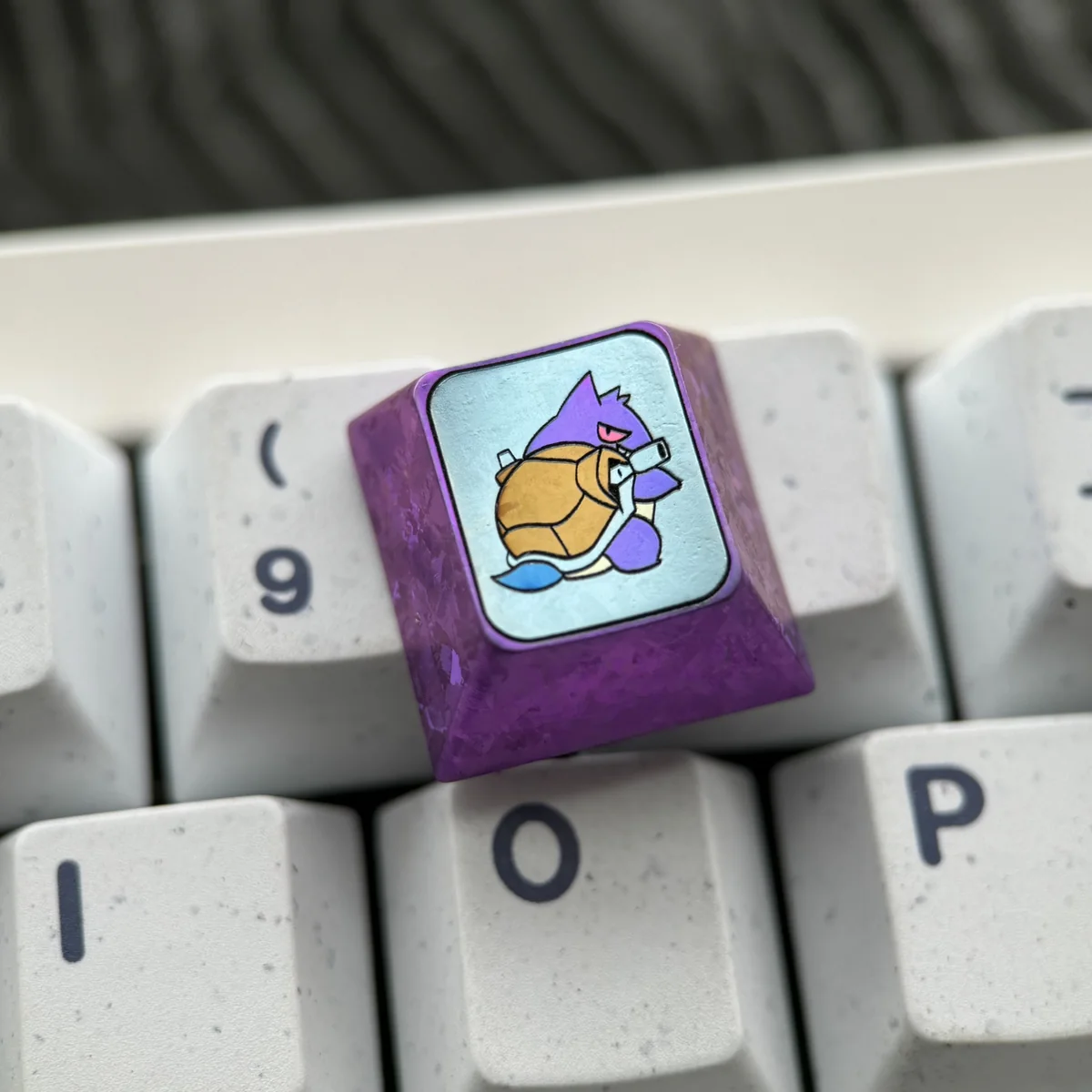 Multiple angles of the premium Gengar Titanium Artisan ESC Keycap, highlighting its intricate design and durable titanium artistry. Essential keyboard design.