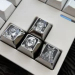 Vibrant Genshin Impact titanium artisan keycaps, showcasing precision-engraved character portraits with pointillist detail, perfect for enhancing your keyboard.
