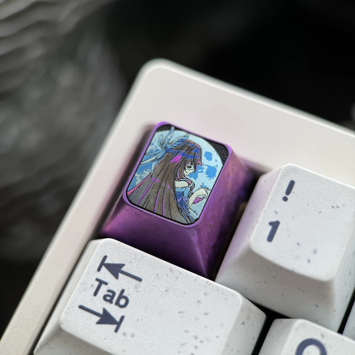 Exclusive Genshin Impact Columbina Titanium ESC Keycap from various angles, revealing its mysterious, dark, and intricately detailed design.