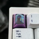 Exclusive Genshin Impact Columbina Titanium ESC keycap, showcasing intricate, mysterious details against a dark background, reflecting ethereal beautifully design.